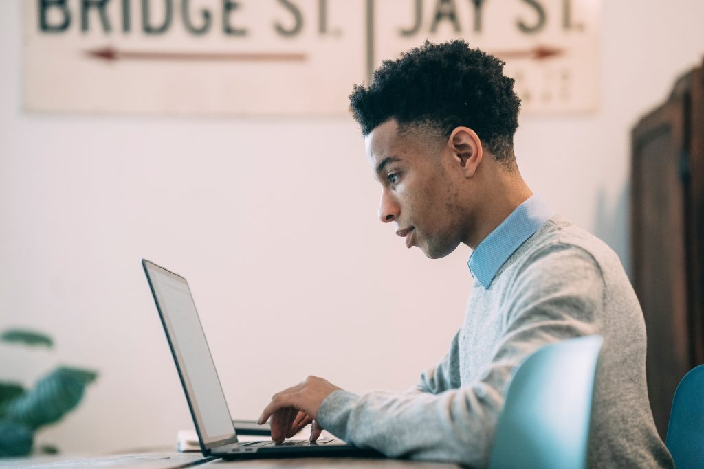 a young man on a computer