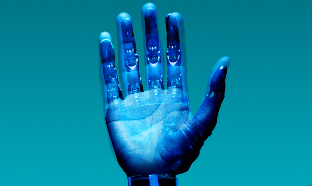 a human hand with a robot exoskeleton overlaid