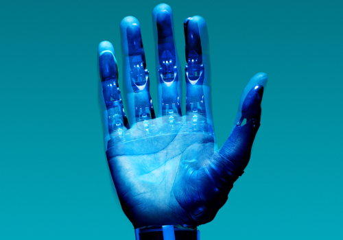 a human hand with a robot exoskeleton overlaid