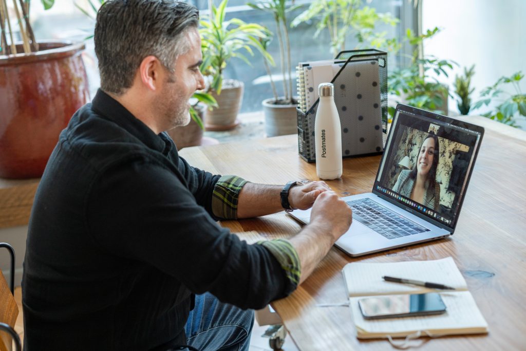 a man in a sweater on a video call