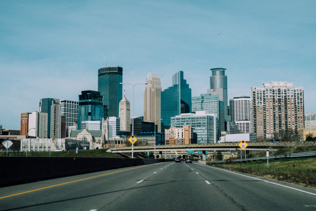 the skyline of minneapolis viewed from the interstate