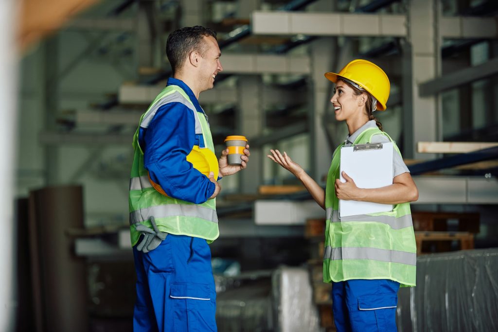 two manufacturing employees chatting