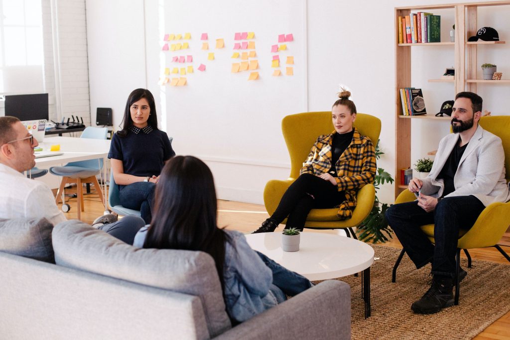 a group of employees in a meeting