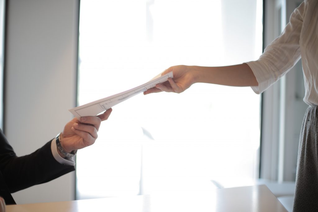 Job Applicant Passing Her Documents