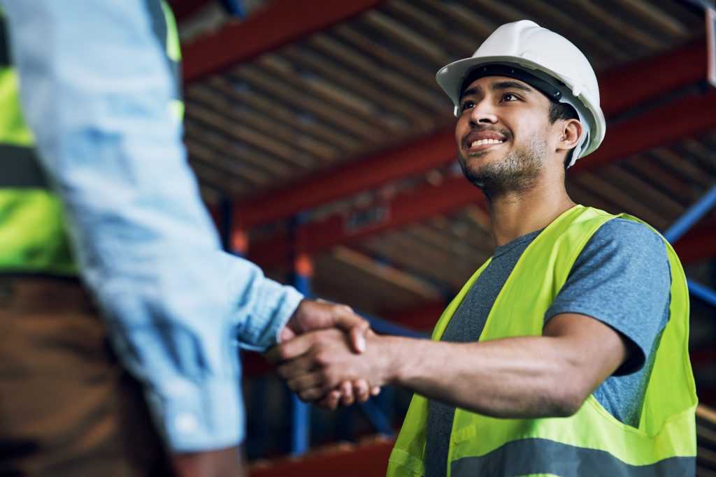 engineer at job interview shaking hands with hiring manager