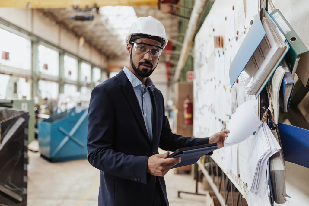 a manufacturing manager taking a look at paperwork