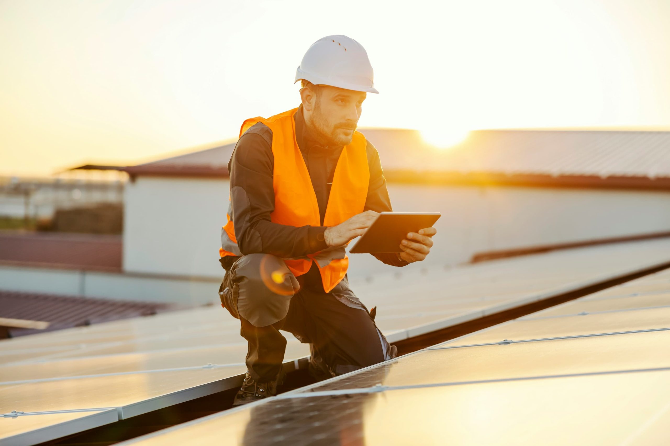 a maintenance technician working on a solar panel